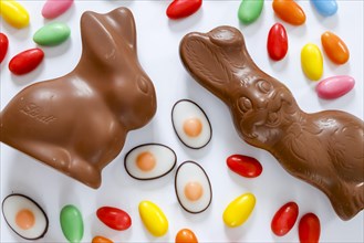 Easter, symbol photo, Easter bunny made of chocolate and colourful Easter eggs, text free space,