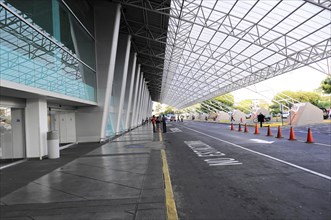 AUGUSTO C. SANDINO Airport, Managua, The entrance of an airport with pedestrians and an area for