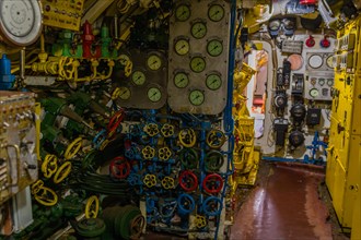 Photo of various gauges, dials, valve controls and other component inside submarine on display at