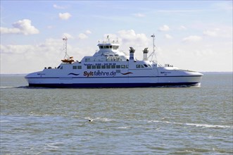 Sylt, Schleswig-Holstein, A ferry of the Sylt ferry fleet glides over a calm sea under a clear blue