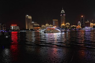 Skyline of Shanghai at night, China, Asia, Illuminated buildings and reflections on the water on a