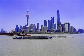View from the Bund to the skyline at the Huangpu River with Oriental Pearl Tower, World Financial
