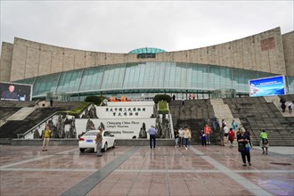 Chongqing, Chongqing Province, China, Asia, Visitors walk towards the stairs of a modern museum