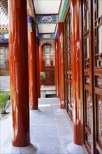 Chongqing, Chongqing Province, China, Asia, corridor between red columns of traditional Chinese