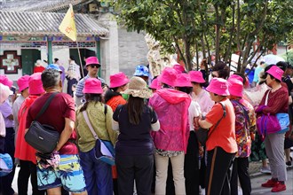 New Summer Palace, Beijing, China, Asia, A group of tourists in eye-catching clothes on a