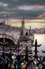 Charles Bridge, figures, place for lovers, fence, bicycle locks, Vltava, Prague, Czech Republic,