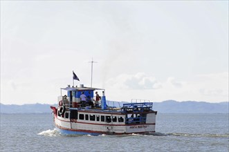 Lake Nicaragua, a small passenger boat sailing on clear water, making waves, Nicaragua, Central