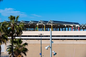 Solar panels mounted on the roofs of an event hall in Barcelona, Spain, Europe
