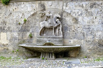 The Martin Fountain at the northeast corner of St. Martin's Church in Memmingen in Unterallgaeu,