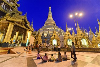 Shwedagon Pagoda, Yangon, Myanmar, Asia, visitors surrounded by golden structures of the pagoda at