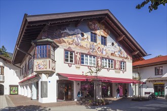 Lueftlmalerei on old house facade with shop in the pedestrian zone of Garmisch, Garmisch district,