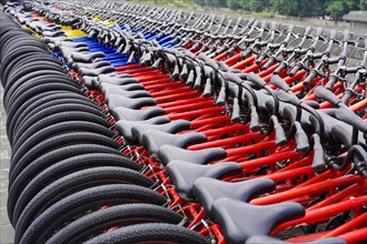 Rental bicycles, Xian, Shaanxi, China, Asia, Orderly rows of bicycles with red frames in a public