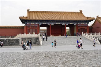 China, Beijing, Forbidden City, UNESCO World Heritage Site, tourists walk through one of the many