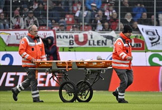 Injury, paramedic, Deurtsches Rotes Kreuz with mobile stretcher on the pitch, Voith Arena,