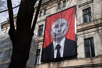 Vladimir Putin as a skull looking at the Russian embassy in Riga, Latvia, Europe
