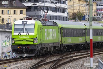 Flixtrain train at Stuttgart main station, track apron with arriving and departing trains,
