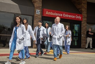 Detroit, Michigan USA, 18 April 2024, Doctors walk out of the emergency room at Ascension St. John