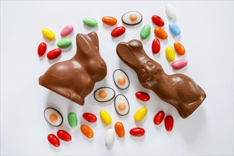 Easter, symbol photo, Easter bunny made of chocolate and colourful Easter eggs, text free space,