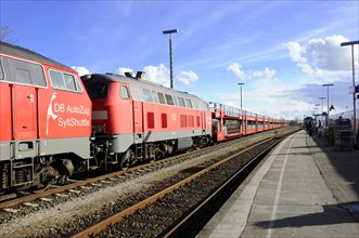 Red DB AutoZug Sylt Shuttle standing on tracks in sunny weather, Sylt, North Frisian Island,