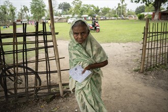 BOKAKHAT, INDIA, APRIL 19: An elderly woman arrives at a polling station to cast her vote during