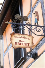 Eguisheim, Alsace, France, Europe, A decorative sign of a winery 'Vins d'Alsace Henri Brecht' on a