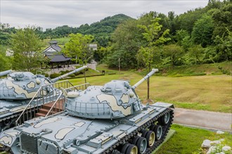 Closeup of military tanks with camouflage paint on display in public park near Nonsan, South Korea