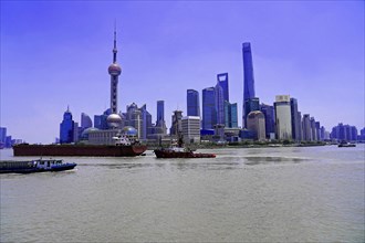 View from the Bund to the skyline on the Huangpu River with Oriental Pearl Tower, World Financial