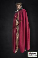 Life-size, carved figure of Jesus with a red cloak on a dark background, 350-year-old processional