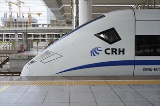 Express train CRH380 to Yichang, A high-speed train stands quietly at a railway station during the