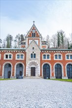 Symmetrical entrance area of a building with brick architecture and arched windows, Alte saltworks,