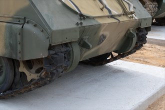 Tracks and lower portion of military vehicle used in Korean war on display in public park in