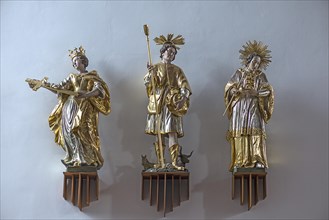 Three figures of saints in St Oswald's Church, Baunach, Upper Franconia, Bavaria, Germany, Europe
