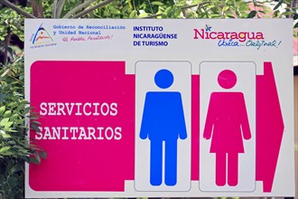 Granada, Nicaragua, A colourful sign marks toilets with blue and pink gender symbols, Central