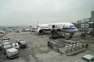 Flight CA 936 Frankfurt, Shanghai China, An aircraft on the tarmac at an airport, supplied by a