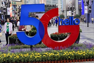 Strolling in Chongqing, Chongqing Province, China, Asia, Advertisement for 5G technology in an