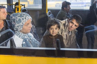 Syrian refugees have arrived at Schoenefeld station on a special train. They are then taken by bus