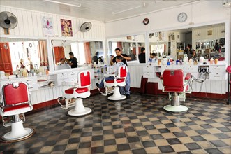 Granada, Nicaragua, Interior view of a traditional hairdressing salon with red and white barber