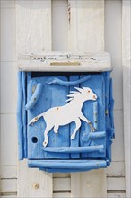 Letterbox with horse motif, Saintes-Maries-de-la-Mer, Camargue, Bouches-du-Rhone,