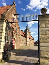 View through the north gate onto the castle courtyard with cobblestones on the outer bailey of the