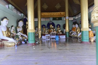 Shwedagon Pagoda, Yangon, Myanmar, Asia, Hall of a Buddhist temple with statues and columns, Asia