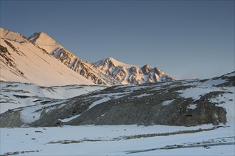 Sunrise at the snowy Cold Peak, Mongolian Chueiten, 3373m, Tavan Bogd National Park, Mongolian