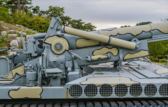 Closeup of military tank with camouflage paint on display in public park near Nonsan, South Korea