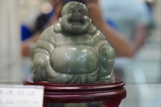Xian, Shaanxi Province, China, Asia, A jade Buddha sculpture is presented in a display case, Xian,