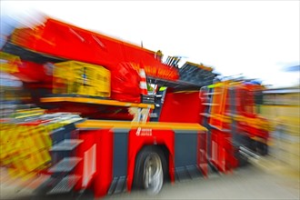 Detailed view of a fire engine in motion with blur effect