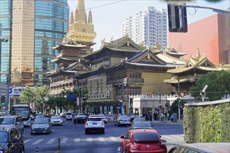 Traffic in Shanghai, Shanghai Shi, People's Republic of China, Traditional temple in front of