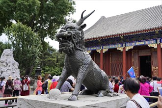New Summer Palace, Beijing, China, Asia, Visitors admire an imposing stone sculpture of a mythical