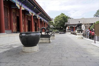 New Summer Palace, Beijing, China, Asia, A large historic cauldron on a stone floor at a historic