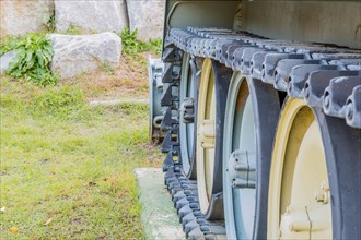 Closeup of wheel assembly and track on a army tank in military history park in Nonsan, South Korea,