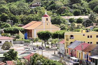 San Juan del Sur, Nicaragua, Municipal square with a church in the centre, surrounded by colourful