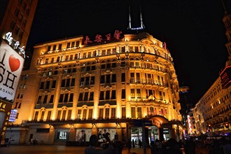 Shanghai by night, China, Asia, Illuminated historical building at night in a busy city street,